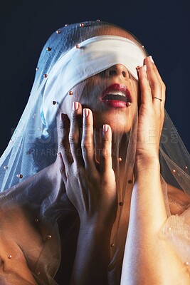 Buy stock photo Blindfolded, veil and woman in studio for creative, fashion and artistic aesthetic on black background. Model, blind and covered vintage beauty by girl model with luxury, fabric and elegant clothing 