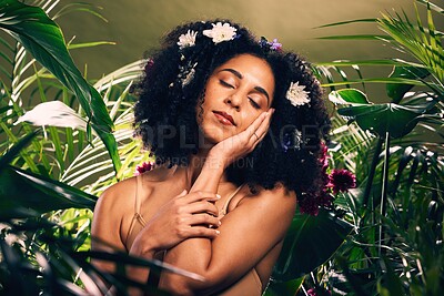Buy stock photo Beauty, flowers and black woman in studio for wellness, skincare and creative advertising in a jungle. Facial, skin and girl model relax in zen, peace and products from nature, forest and aesthetic  