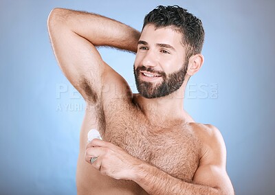 Buy stock photo Deodorant, skincare roll and man in studio grooming for hygiene, fresh scent and perfume. Male model, armpit and cosmetics for sweat control, body odor and cleaning product for beauty on background