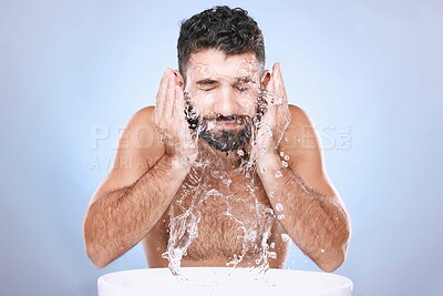 Buy stock photo Face, skin care and man with water splash for clean spa facial for beauty hygiene and dermatology. Aesthetic model person on blue background for health and wellness cosmetics, body and detox cleaning