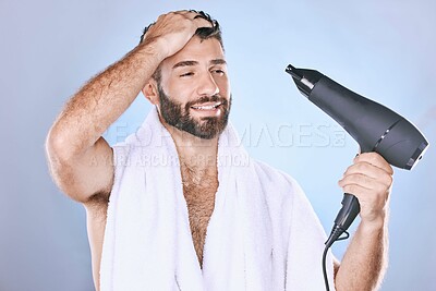 Buy stock photo Beauty, hair care and man with blow dryer on blue background for cleaning, body wellness and salon. Luxury spa, shower and male with drying appliance for grooming, shine and cosmetics treatment