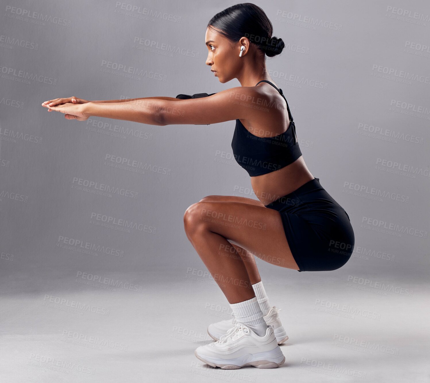 Buy stock photo Exercise, black woman and squat for training, workout and fitness for health, wellness and grey studio background. Female, lady and athlete bending, stretching and practice for endurance and energy