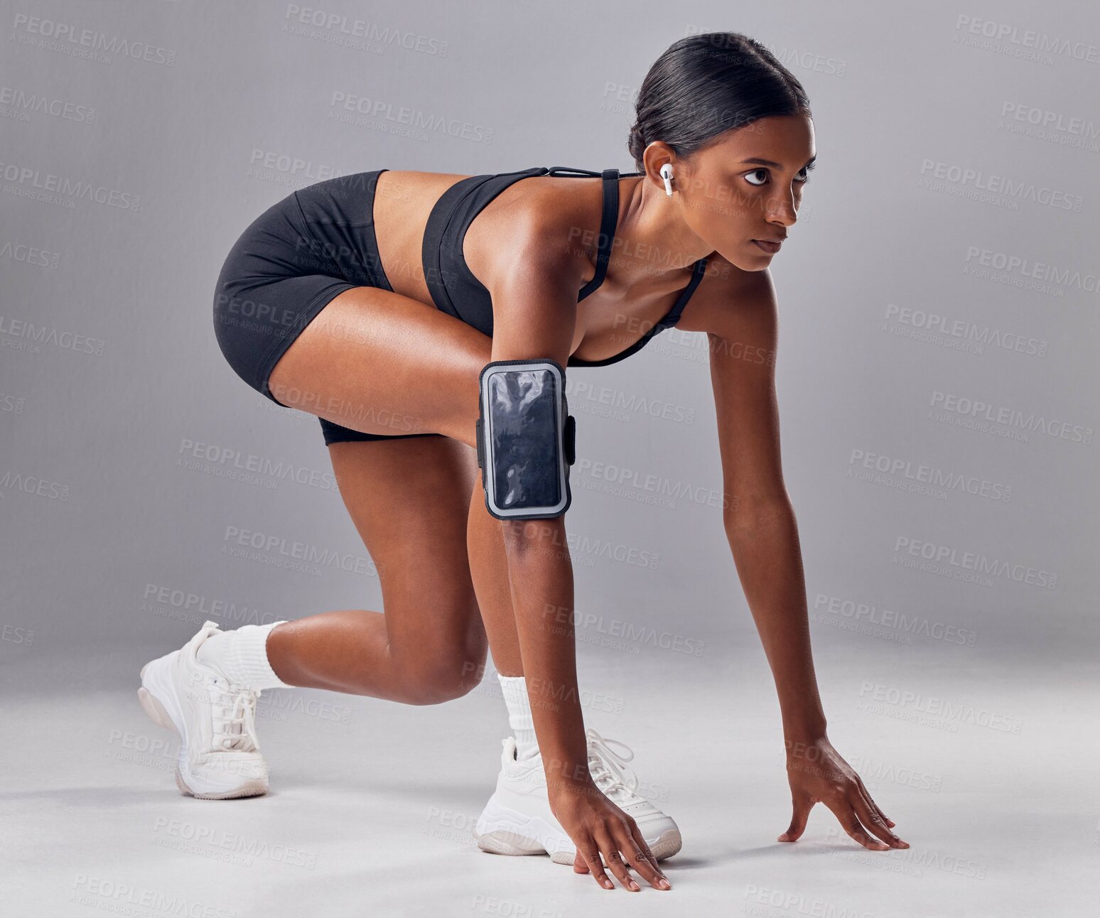 Buy stock photo Start, race or running with a sports woman in studio, ready for competition on a gray background. Fitness, exercise and health with a female runner or athlete at the beginning of a marathon or sprint