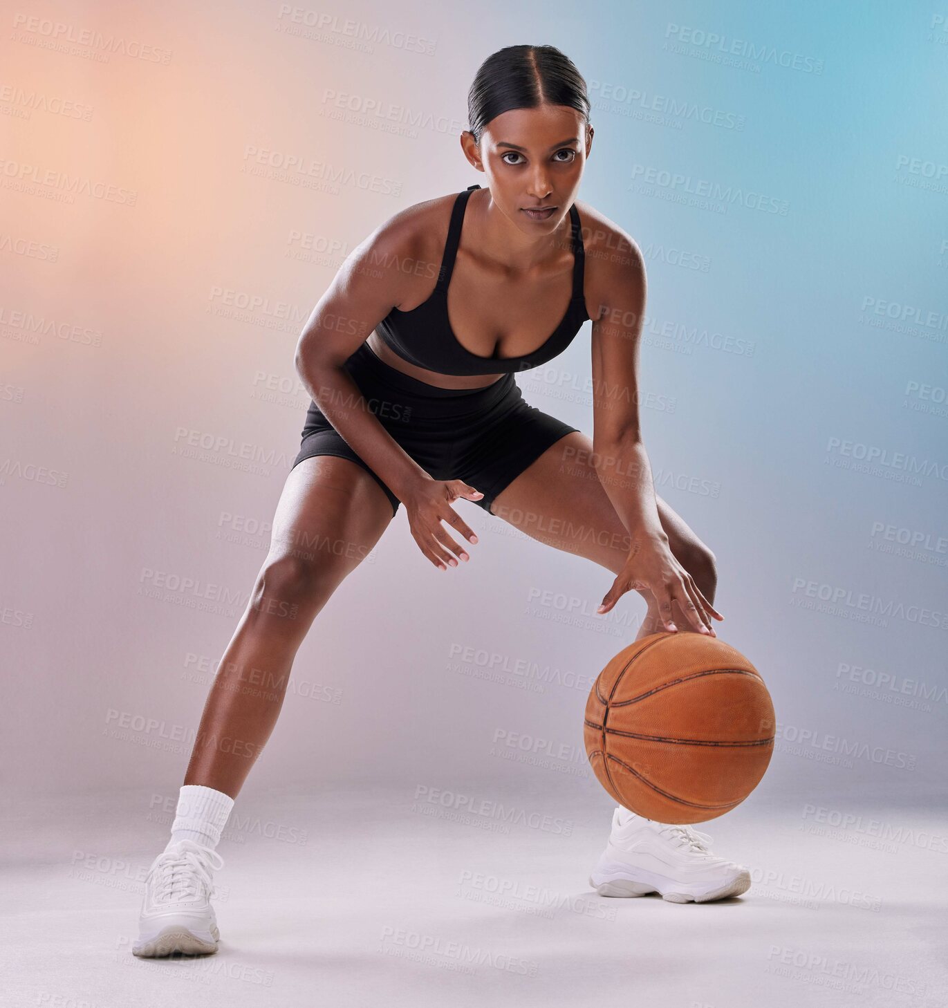 Buy stock photo Portrait, basketball player or black woman isolated on gradient background in action, challenge and body workout. Indian person or fitness model in studio training, exercise and ball in focus mindset