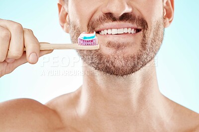 Buy stock photo Smile, mouth or happy man brushing teeth with dental toothpaste for healthy oral hygiene grooming in studio. Eco friendly, zoom or male model cleaning with a smile or natural bamboo wood toothbrush 