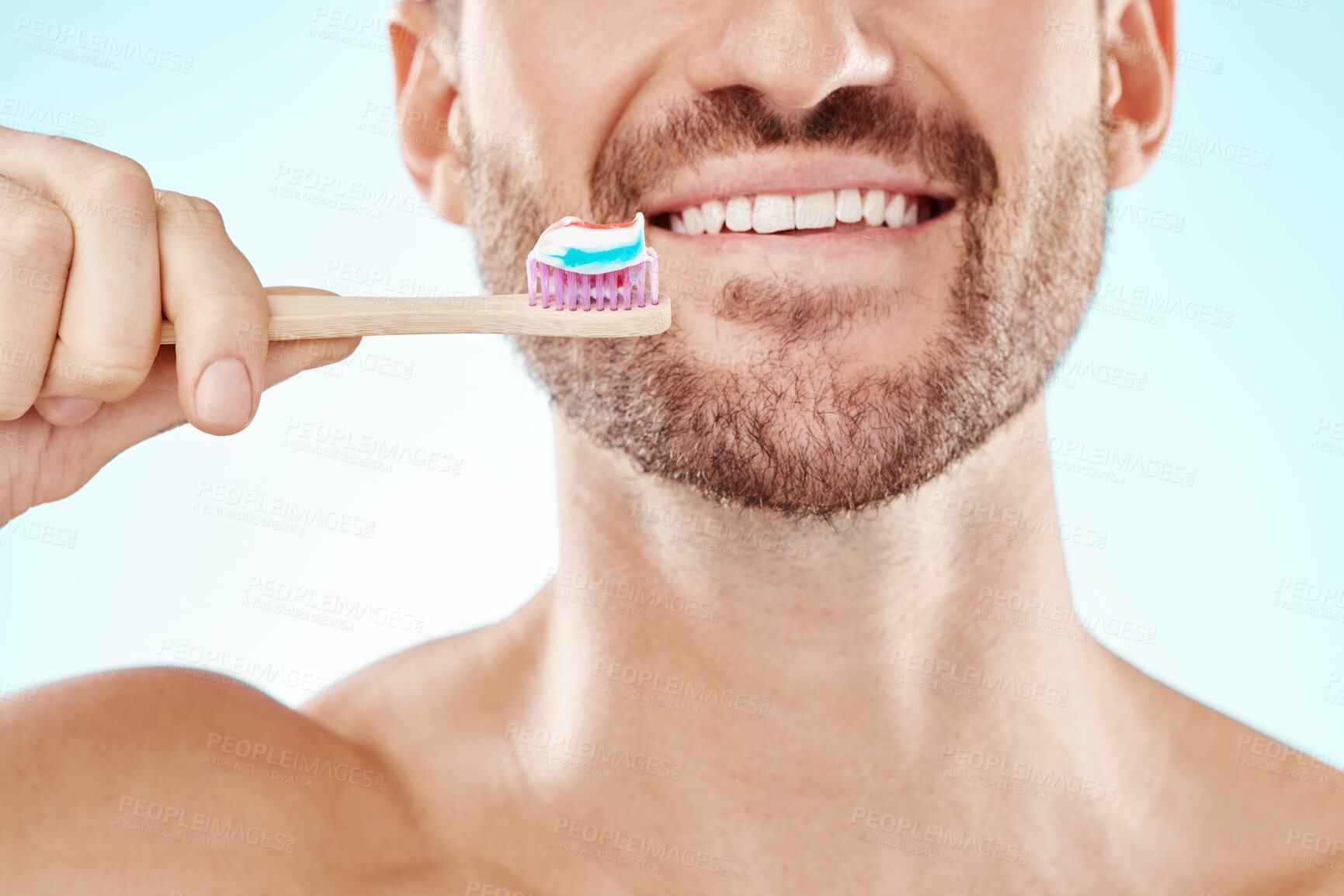 Buy stock photo Smile, mouth or happy man brushing teeth with dental toothpaste for healthy oral hygiene grooming in studio. Eco friendly, zoom or male model cleaning with a smile or natural bamboo wood toothbrush 