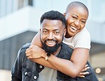 Portrait of black couple piggyback in city for love, care and happiness on date together in Nigeria. Happy man carrying young woman in urban street for outdoor fun, freedom and relax with face smile