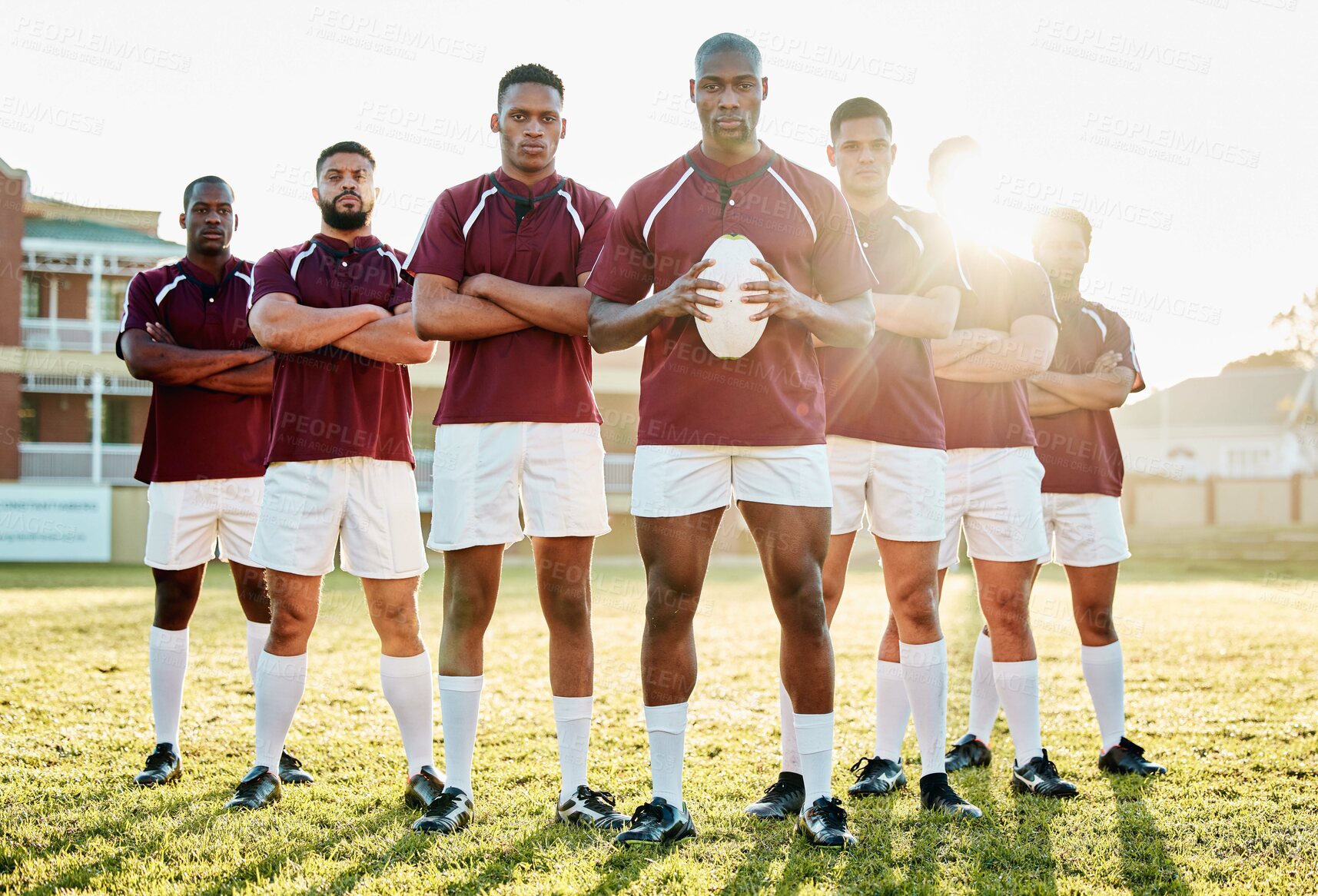 Buy stock photo Rugby, grass and portrait of men, team with ball and standing together with confidence for winning game. Diversity, black man and group of strong sports people in leadership, fitness and teamwork.
