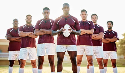 Buy stock photo Rugby, black man with ball and team portrait on field, solidarity and confidence for winning game. Diversity, leadership and teamwork, group of strong sport people standing together in power on field