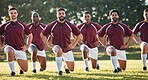 Rugby, racial activism or team take a knee in solidarity or support for a match, game or sports match. Men, fitness or group of male athletes in unity against inequality or global racism on grass