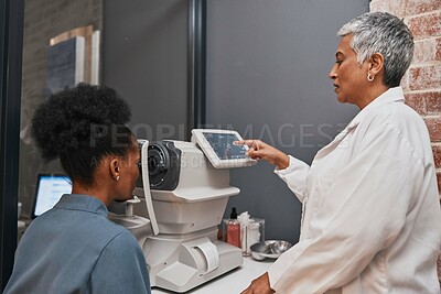 Buy stock photo Digital eye exam, vision and health for eyes, optometry and doctor with patient, eyecare and ophthalmology clinic. Machine, screen and black woman with senior optometrist, service and medical exam