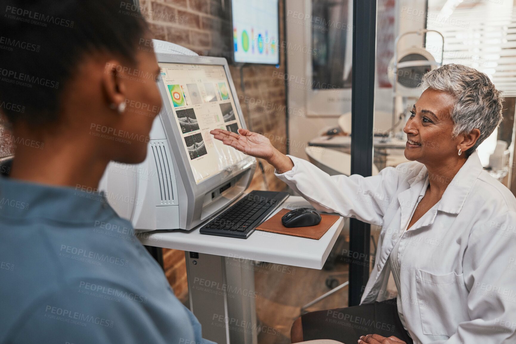 Buy stock photo Elderly ophthalmologist woman, computer and eye exam results with consultation, advice and smile. Optometrist, doctor and happy with African patient for analysis, consulting or medical help in office