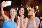 Peace sign, friends and selfie with women in restaurant for social media, freedom and support. Happy, diversity and phone with girl and phone in cafe for picture, networking and relax on weekend