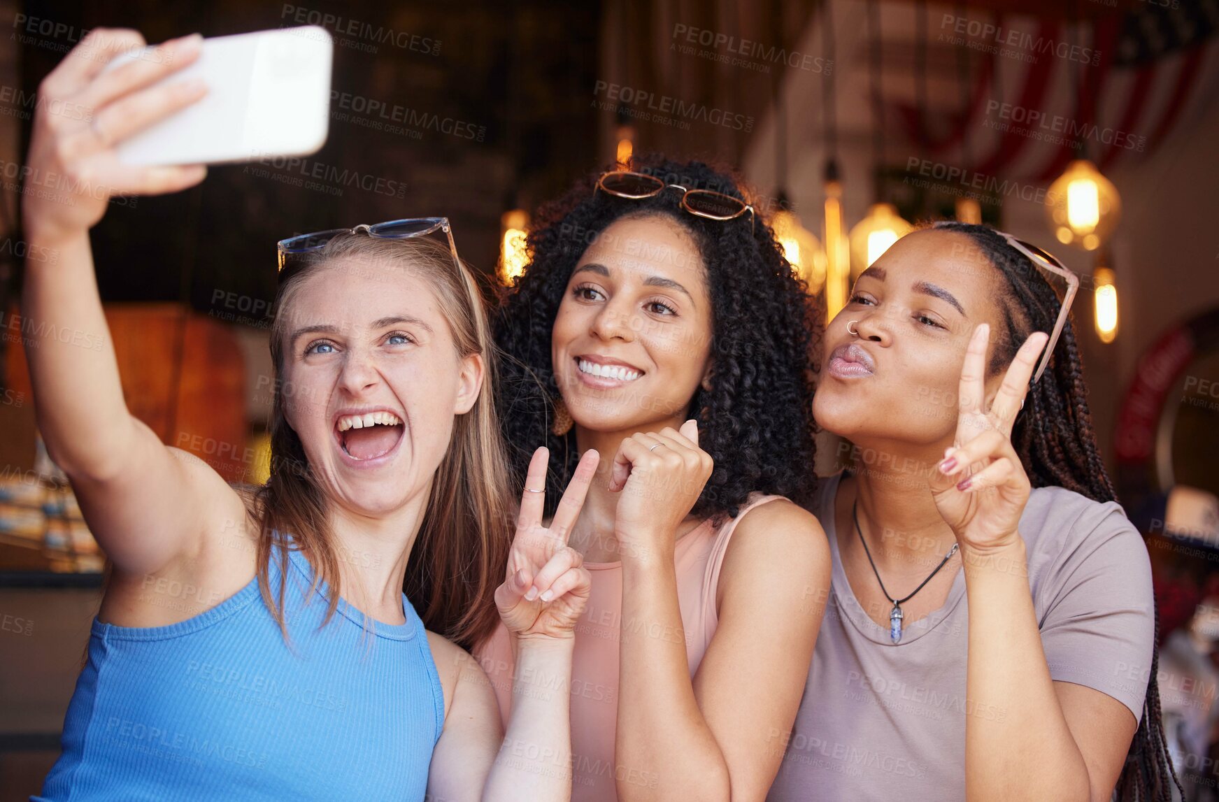 Buy stock photo Peace sign, friends and selfie with women in restaurant for social media, freedom and support. Happy, diversity and smile with girl in coffee shop for picture, networking and relax on weekend