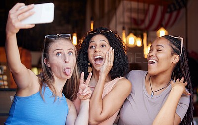 Buy stock photo Wow, friends and selfie with women in restaurant for social media, freedom and support. Happy, diversity and excited with girl and phone in coffee shop for picture, networking and relax on weekend