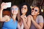 Sunglasses, friends and selfie with women in restaurant for social media, freedom and support. Happy, diversity and phone with girl and phone in cafe for picture, networking and relax on weekend