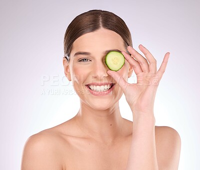 Buy stock photo Woman, portrait or hand with cucumber for skincare nutrition or healthy diet isolated studio background. Face of happy beauty model with smile, fruit or organic facial treatment or natural cosmetics