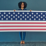 Portrait, American flag and woman with smile, patriotic and pride for country against a wall. Face, female and person with USA symbol, confidence and motivation for freedom, human rights or happiness