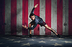 Portrait, fitness and a sports man with a usa flag in studio on a stars and stripes background for competition. Health, exercise or patriot with a male athlete representing the red, white and blue