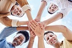 Below circle, hand stack and business people with support, smile and portrait for motivation by sky. Men, women and hands together for solidarity, diversity and happiness with team building at job