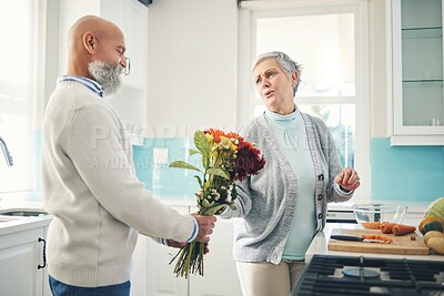 Buy stock photo Love, gift and mature couple with flowers, happiness and bonding at home, romantic or anniversary. Romance, senior man or old woman with floral present, quality time or surprise with joy and cheerful