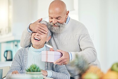 Buy stock photo Old couple, surprise and gift with anniversary, happiness and retirement with marriage, love or relationship. Happy, senior man or elderly woman with a present, home or cheerful with romance or smile