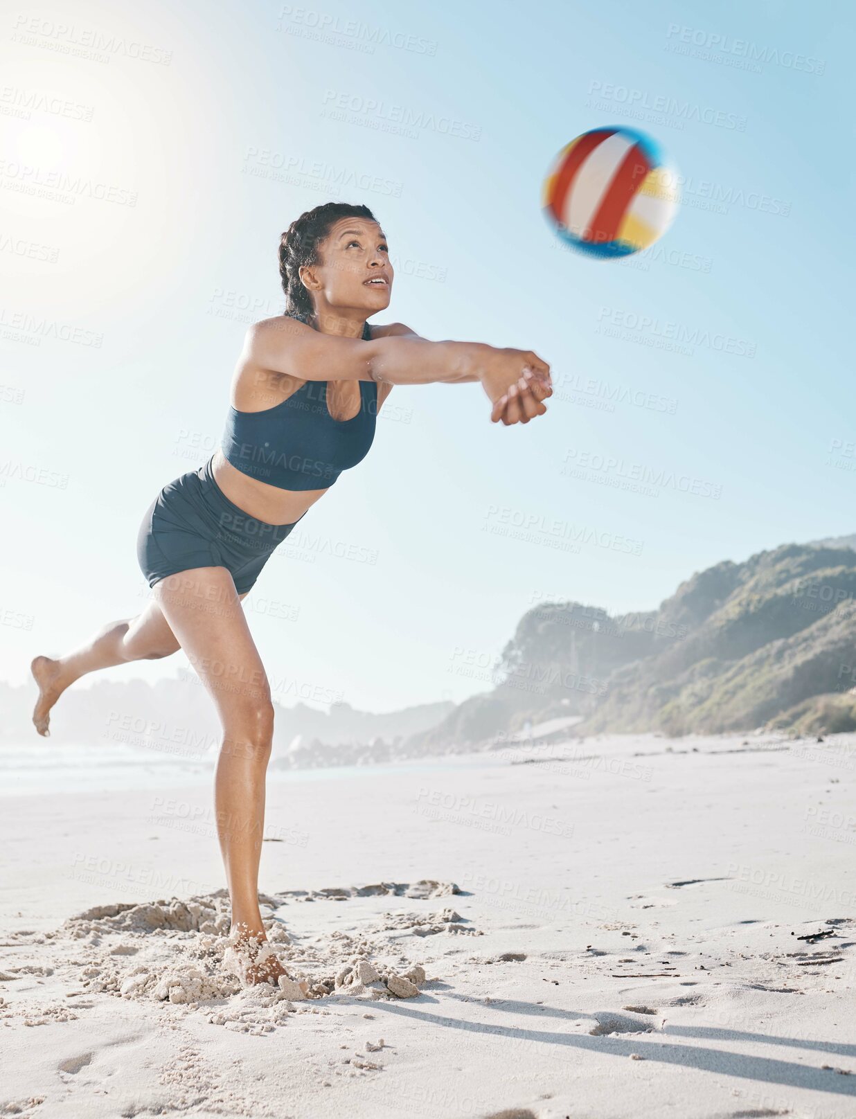 Buy stock photo Woman, volleyball and hitting on beach in sports game, practice match or competition in the outdoors. Female person or player in volley or spiking ball up for fitness, point or athletics by the ocean