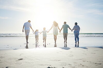 Buy stock photo Beach, holding hands and grandparents, parents and kids for bonding, quality time and relax in nature. Family, travel and back of mom, dad and children walking on holiday, vacation and adventure