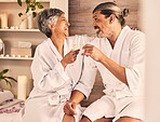 Couple, spa and wine glasses for toast in massage, vacation or holiday celebration, love and romance. Champagne, excited and senior people for luxury, wellness and relax, hospitality service or hotel