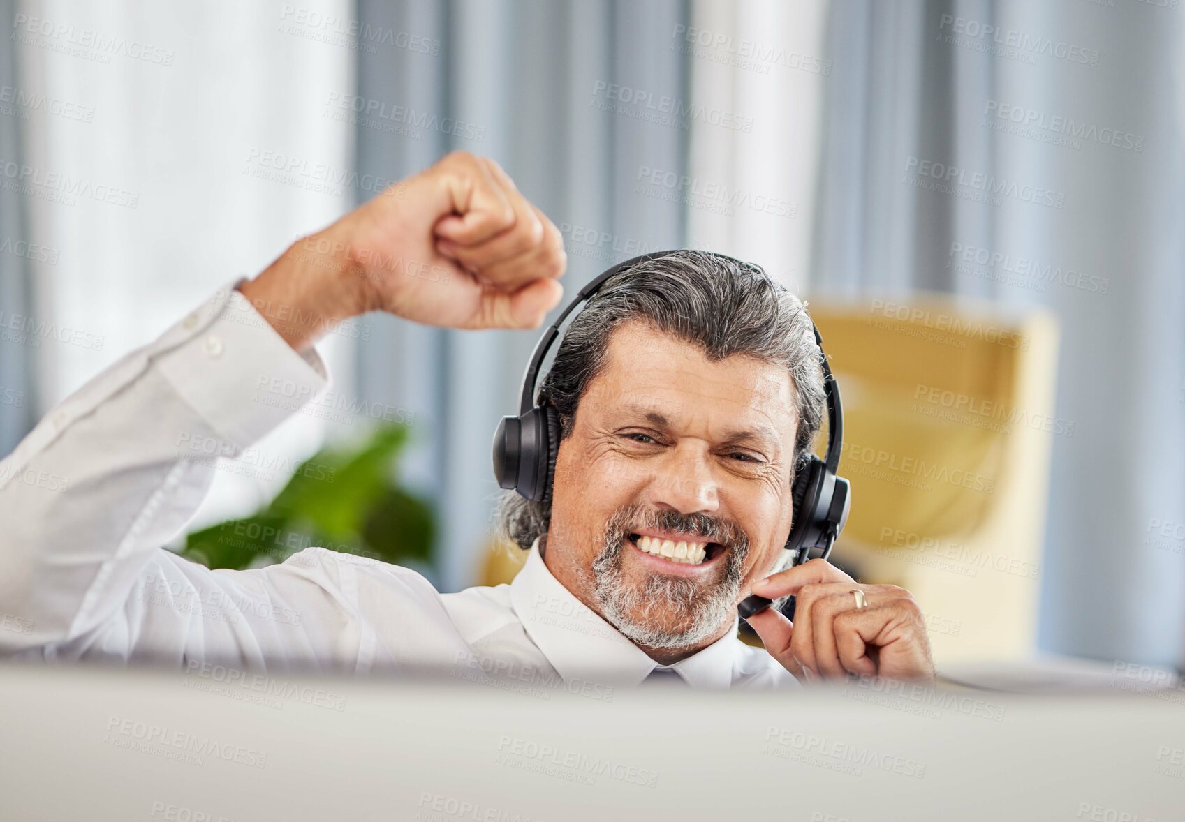 Buy stock photo Call centre, celebrate and a happy man at a computer with success, achievement or bonus win. Mature male consultant or agent with fist for customer service, help desk and crm or telemarketing target