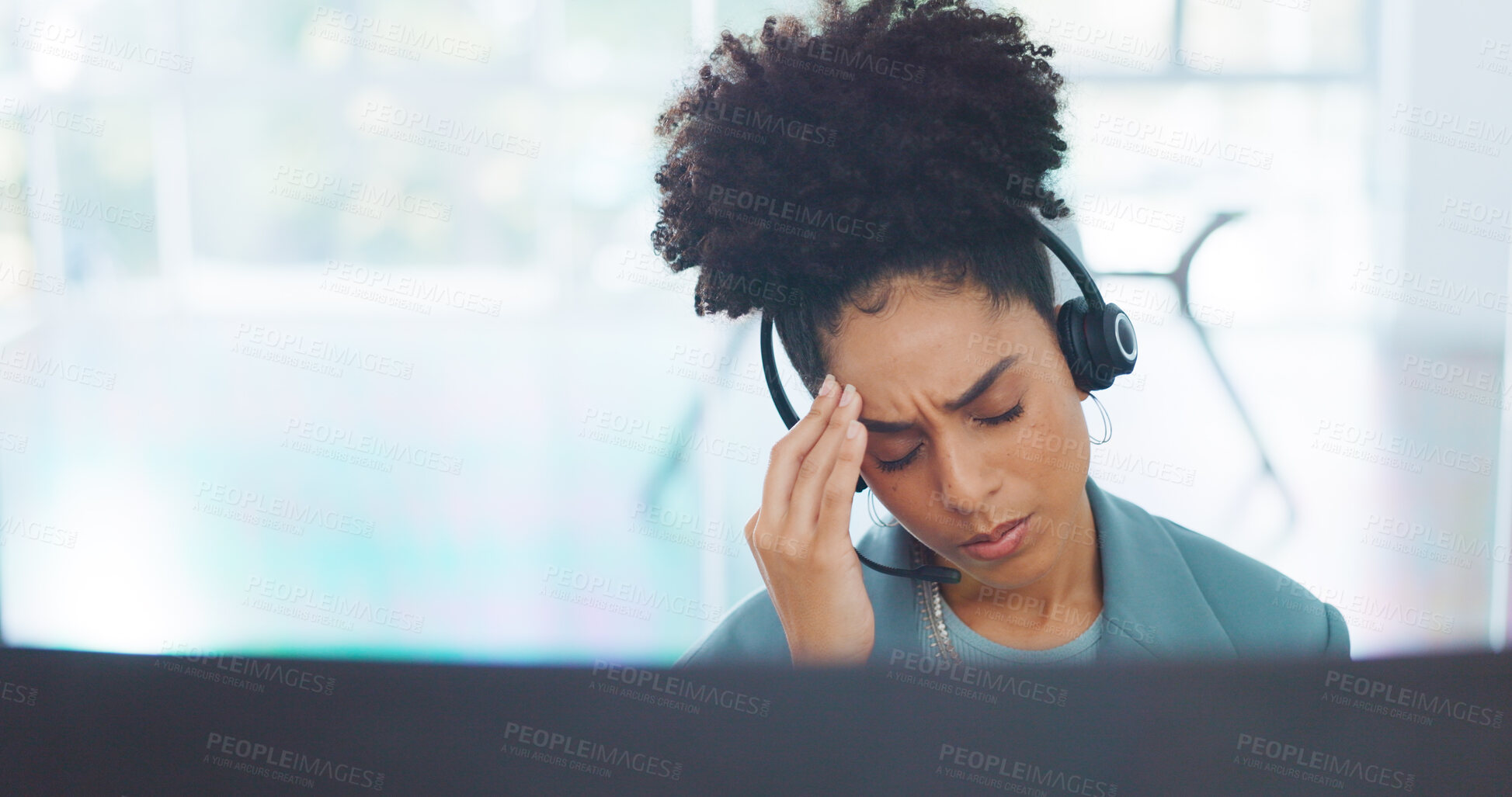 Buy stock photo African, call center and agent with a headache working in customer service with fatigue, burnout and stress in crm job. Migraine, pain and woman in telemarketing, communication or technical support