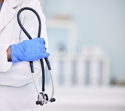 Buy stock photo Doctor, hand and stethoscope of professional with arms crossed for medical or healthcare at hospital. Closeup of nurse or surgeon holding tool or equipment in cardiology, health or wellness at clinic