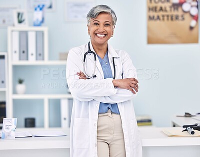 Happy senior woman, doctor and professional with arms crossed in confidence for healthcare at hospital. Portrait of mature female person, medical expert or surgeon smile for health service at clinic