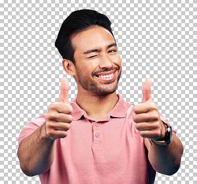 Portrait, thumbs up and wink by asian man in studio with positive, feedback or review on blue background. Face, smile and hand gesture by male showing yes, agreement and vote emoji while isolated