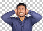 Stress, noise and man closing his ears in studio isolated on a gray background. Loud, mental health and upset, angry or mad business person with headache, depression or anxiety from noisy sound.