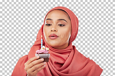 Muslim, woman and cupcake with candle, birthday wish and celebration with dessert isolated on white background. Blowing flame, cake and sweets, hijab and party with event, food and gift in studio