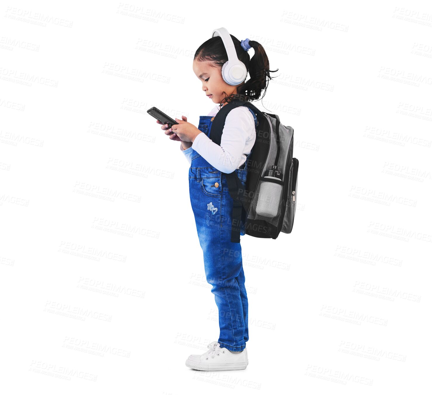 Buy stock photo Child, phone and ready for school, education and learning or headphones, streaming podcast and class. Female person, girl and kindergarten or app, backpack and isolated on transparent png background