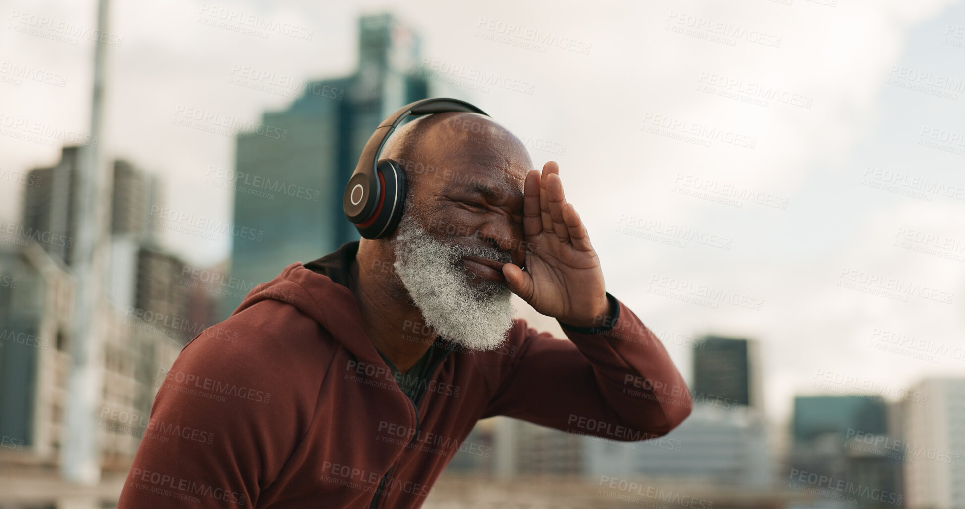 Buy stock photo Senior, fitness and tired man in a city with music headphones for intense, cardio or training outdoor Sport, fatigue and elderly male runner stop for break, breathe and sweating from running workout