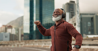 Buy stock photo Fitness, celebration and senior man, headphones, city and achievement with workout, streaming music and radio. African person, pensioner and runner with headset, progress and exercise wellness or joy