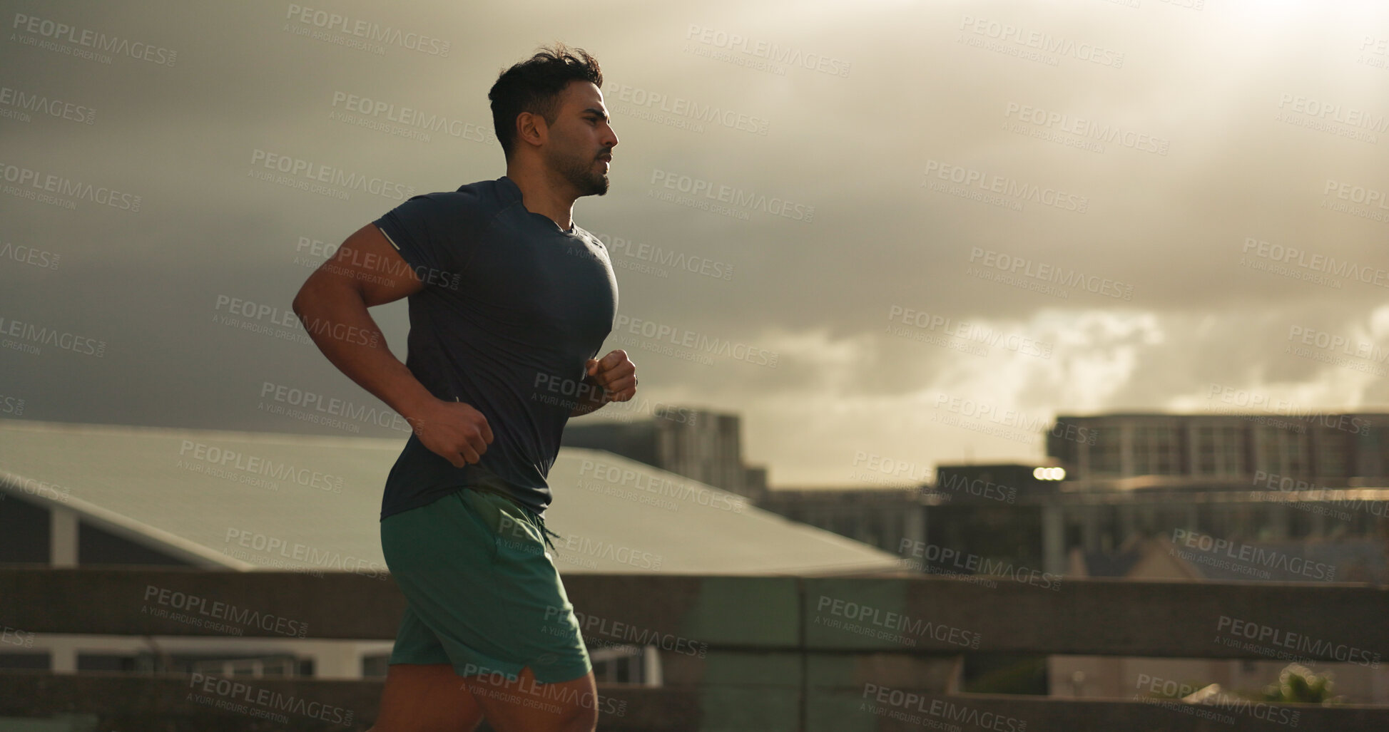 Buy stock photo Running, city or man athlete in workout by training, cardio jog or fitness goals for marathon competition. Indian runner, wellness or progress in race, exercise or strong health body on urban road 