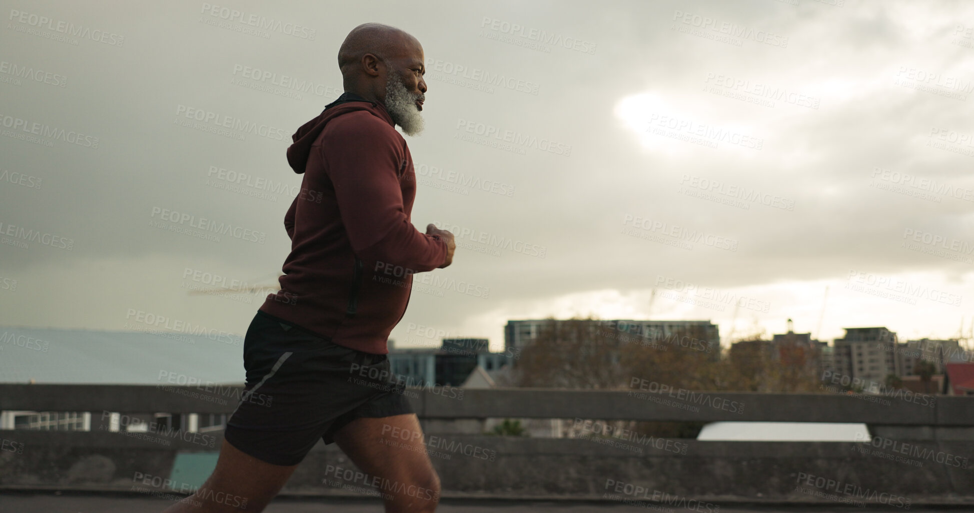 Buy stock photo Man, city or senior runner with cardio workout in training, road fitness for health lifestyle. African athlete, retirement or wellness for strong body in leisure, cape town or exercise on urban road 