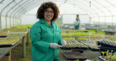 Buy stock photo Woman, greenhouse and portrait with gardening and agriculture work with a smile of food farmer. Sustainability, plants and soil with agro career and farming with produce and growth inspection