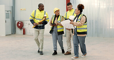 Buy stock photo Construction site, blueprint and business people walking in a building planning, discussion or renovation idea. Architecture, project management and engineer team in warehouse for design conversation