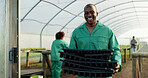 Portrait, farmer and black man with tray at greenhouse for organic vegetables, plant and growth for sustainability. Face, smile and person at nursery for agriculture, African worker or business owner