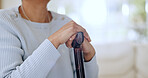 Hands, walking stick and closeup for woman in home with injury, recovery and wellness for mobility. Person with disability, cane and rehabilitation from accident for healthcare, progress and steps