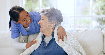 Buy stock photo Senior woman, nurse and retirement home on sofa, blanket and care for support, comfort and nursing. Friendly, kindness and elderly for healthcare, wellness and worker for patient, respect and talk 
