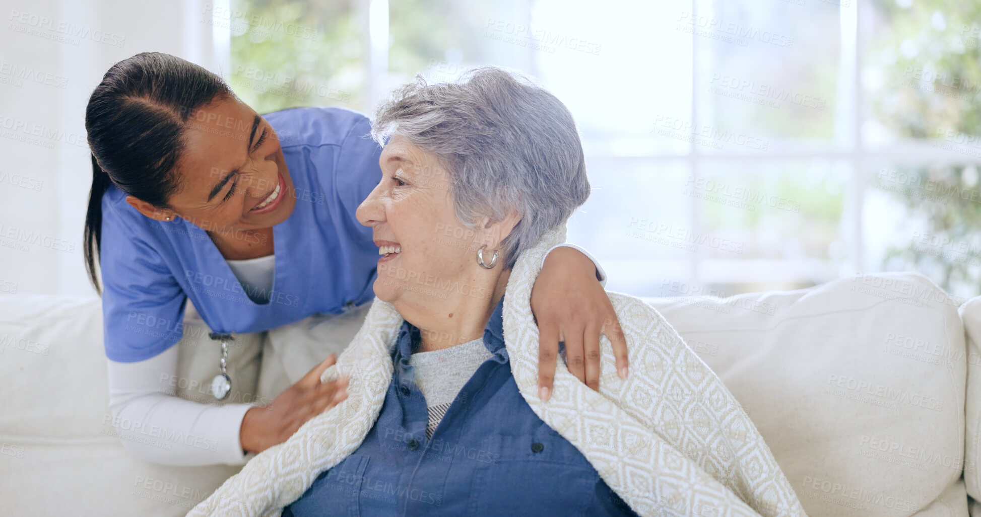 Buy stock photo Senior woman, nurse and retirement home on sofa, blanket and care for support, comfort and nursing. Friendly, kindness and elderly for healthcare, wellness and worker for patient, respect and talk 
