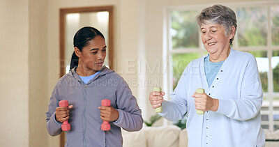 Buy stock photo Dumbbell weights, physiotherapy and an old woman with a caregiver in a nursing home for training. Health, fitness or exercise with a senior patient and person in a living room for physical therapy