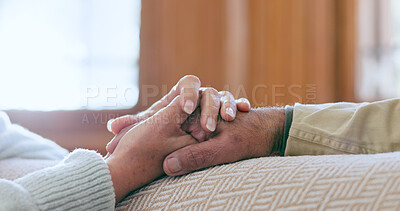 Buy stock photo Comfort, support and senior couple holding hands in living room at modern home for romance and compassion. Love, empathy and closeup of elderly man and woman with affection in the lounge of a house.