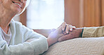Support, love and senior couple holding hands in conversation in the living room at home. Discussion, affection and closeup of elderly man and woman in retirement with comfort in lounge at house.